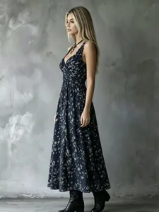Elegant V-neck navy floral maxi dress with cinched waist for a stylish vacation look