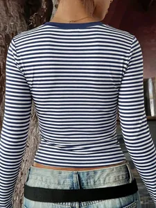 Close-up rear view of a trendy slim-fit blue and white striped long-sleeved T-shirt