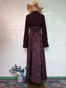 Back view of a French retro purple long-sleeved dress with lace-up waist detail