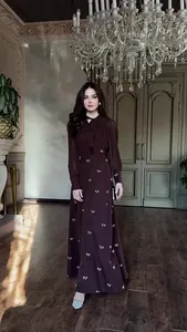 Full view of an elegant French retro long-sleeved dress in a luxurious room setting