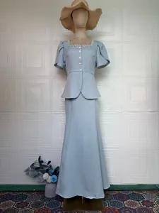 Elegant light blue two-piece set featuring a peplum top and mermaid maxi skirt.