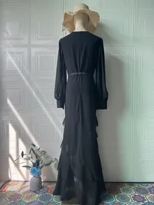 Elegant black long sleeve maxi dress featuring ruffled hem and belted waist back view