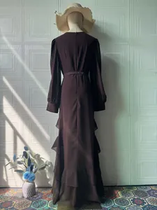 Elegant long sleeve dark brown maxi dress with ruffled hem and waist tie detail
