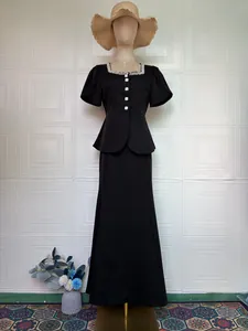 Elegant black two-piece set featuring pearl collar short sleeve top and high-waisted long skirt