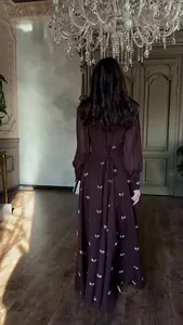 Detailed back view of a French vintage maxi dress with lace-up corset and butterfly prints