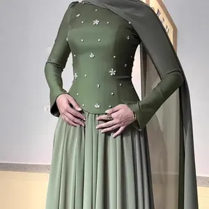 Elegant olive green long-sleeved modest dress with beaded flowers and pleated skirt