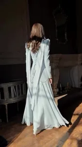 Back view of elegant palace-style light blue maxi dress with lace-up detail