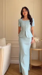 Elegant light blue peplum top and long skirt set with embellished neckline.