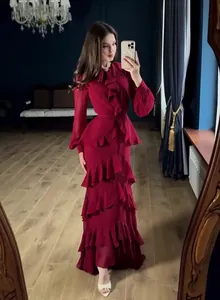 Full length view of an elegant wine red long sleeve maxi dress with tiered ruffles