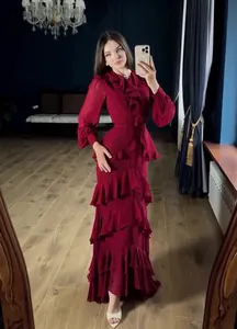 Elegant deep red ruffled maxi dress with long sleeves for a sophisticated evening look