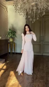 Elegant long-sleeved vintage palace style light pink maxi dress with tiered skirt