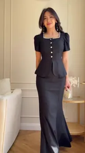 Elegant black two-piece set with embellished square neck peplum top and maxi skirt