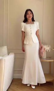 Elegant white two-piece fashion set with puff sleeve top and long fishtail mermaid skirt