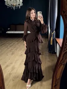 Elegant dark brown long sleeve maxi dress featuring ruffles and tiered skirt design