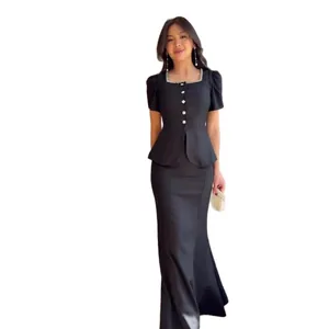 Elegant black two-piece set with short sleeve peplum top and mermaid skirt