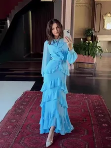 Elegant sky blue tiered ruffle maxi dress featuring long sleeves and a cinched waist design