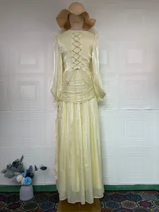 Back detail of an elegant yellow French style maxi dress with lace-up design!!
