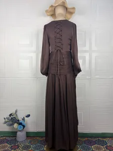 Detailed back view of an elegant French style long-sleeve maxi dress in chocolate brown