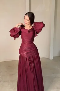 Elegant French style pleated burgundy long sleeve maxi dress for women shown in detail
