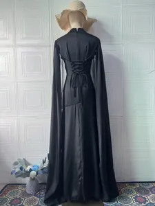 Elegant black maxi dress featuring corset lace-up back and flowing long sleeves detail