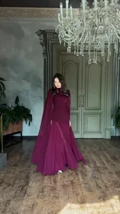 Elegant long-sleeved burgundy floor-length dress for formal evening events and galas