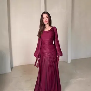 Elegant French style burgundy long-sleeve pleated maxi dress with a cinched waist design
