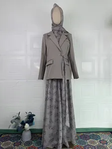 Full view of elegant grey modest three-piece suit set featuring blazer and floral maxi skirt