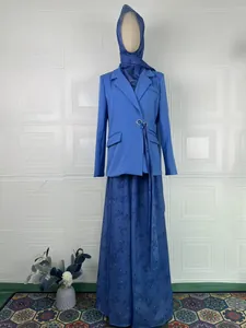 Elegant three-piece blue suit with blazer, patterned maxi skirt, and matching hijab.