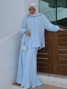 Detailed view of elegant light blue modest linen shirt and long maxi skirt set for women