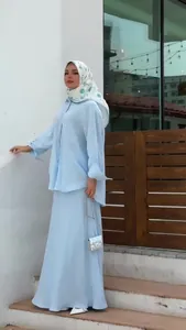 Elegant light blue long sleeve top and maxi skirt set for modest summer fashion