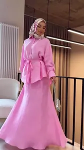 Elegant pink modest fashion set with long-sleeve shirt and matching A-line maxi skirt