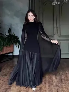 Elegant black long-sleeved maxi dress with sheer cape sleeves, perfect for formal evening events