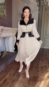Elegant vintage polka dot midi dress with lace Peter Pan collar and heart buckle belt.