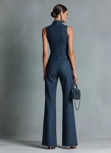 Back view of a vintage dark blue sleeveless denim jumpsuit with a slim fit silhouette