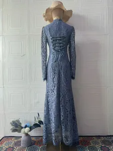 Back view of a blue Victorian lace long sleeve maxi dress on mannequin