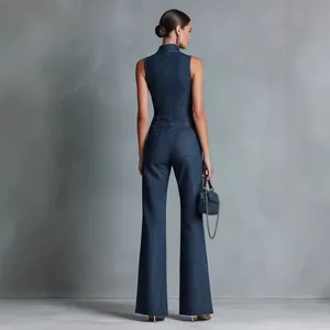 Elegant retro dark blue sleeveless high-neck denim jumpsuit with a slim fit back view