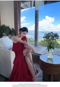 Red one-shoulder pleated maxi dress featuring an elegant flowy skirt for vacations
