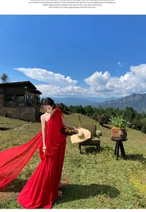Elegant red one-shoulder pleated maxi dress with train for outdoor vacation photoshoot