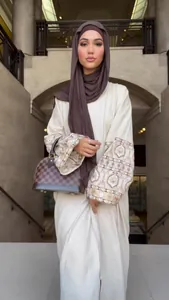 Elegant cream bohemian maxi dress with ornate printed puff sleeves and matching hijab