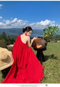 Red one-shoulder pleated flowing maxi dress for vacation and photoshoots