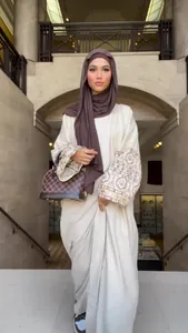 Bohemian cream long dress with embroidered puff sleeves and brown hijab detail