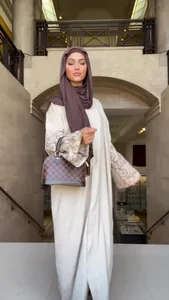 Bohemian loose long dress with printed puff sleeves shown in a classic indoor setting