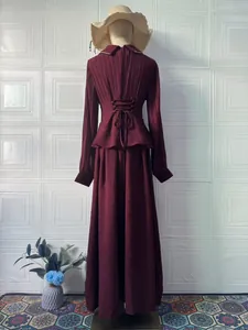 Back view of elegant maroon long-sleeve maxi dress with pleated waist detailing