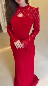 Detailed view of an elegant red lace Victorian-style long-sleeved dress for evening events.