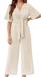 Detail shot of an elegant minimalist V-neck solid color short sleeve jumpsuit in beige