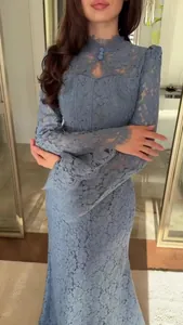 Exquisite detail of a blue Victorian lace long sleeve maxi dress with elegant flared sleeves.