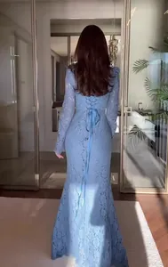 Detailed back view of an elegant light blue lace Victorian evening gown with corset lacing