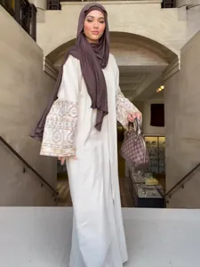 Elegant bohemian loose maxi dress with patterned wide sleeves for women with brown hijab