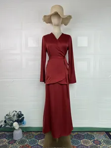 Elegant dark red satin wrap top and matching long skirt set displayed on a mannequin