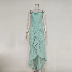 Front view of a mint green sleeveless ruffled camisole dress with high-low hemline